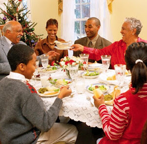 Family Enjoying Christmas Dinner --- Image by © Ariel Skelley/CORBIS